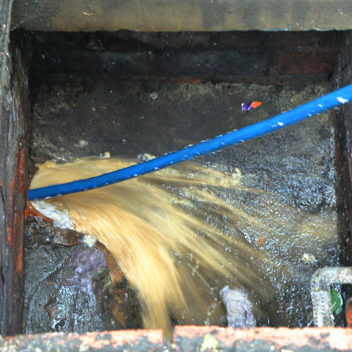 A close up picture of a drain being jetted