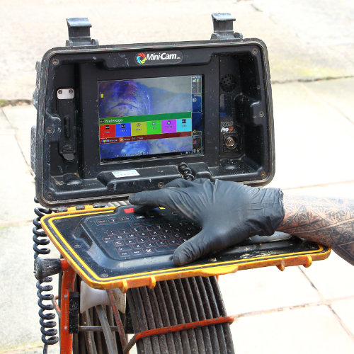 A drain survey system showing the view of a camera going through the drain