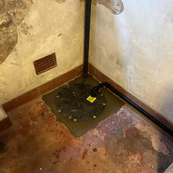 A finished sump pump installation in a basement